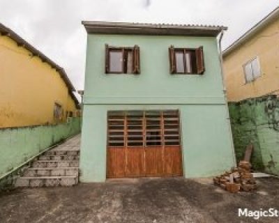 Casa à venda com 127m², 2 dormitórios, 4 vagas no bairro Partenon em Porto Alegre