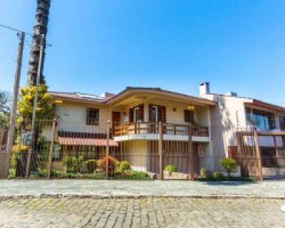 Casa à venda com 264m², 4 dormitórios, 2 suítes, 4 vagas no bairro Jardim Isabel em Porto Alegre