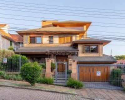 Casa à venda com 498m², 4 dormitórios, 4 suítes, 5 vagas no bairro Ipanema em Porto Alegre